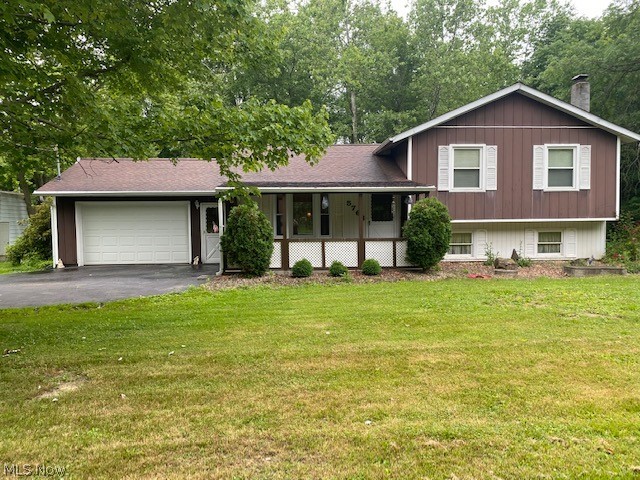 Located on 3 peaceful acres with a wooded backdrop  is a 3 level split, 3 bedroom, 2 full bath, one owner home looking for a new resident!  This home was lovingly built by a husband and wife for their family.  The open concept living room and kitchen area is great for entertaining.  Relax and unwind in the 17x17 sunroom addition with picturesque views. (sunroom is ready for heat to enjoy year round).   The first floor full bath has a stand up shower and access to the 1.5 car attached garage.  Upstairs you will find 3 nice sized bedrooms with ample closet space and anther full bath.  The lower level boasts a large family room, and huge laundry room area with storage and a crawl space.  A 4 + car detached garage with dry wall and 220 electric sits adjacent to the home on
this 313ft. wide country lot. There is a metal outbuilding that will not stay, seller is having it removed.  Seller has not had the septic inspected as of yet but with an acceptable offer, the seller is willing to pay f
