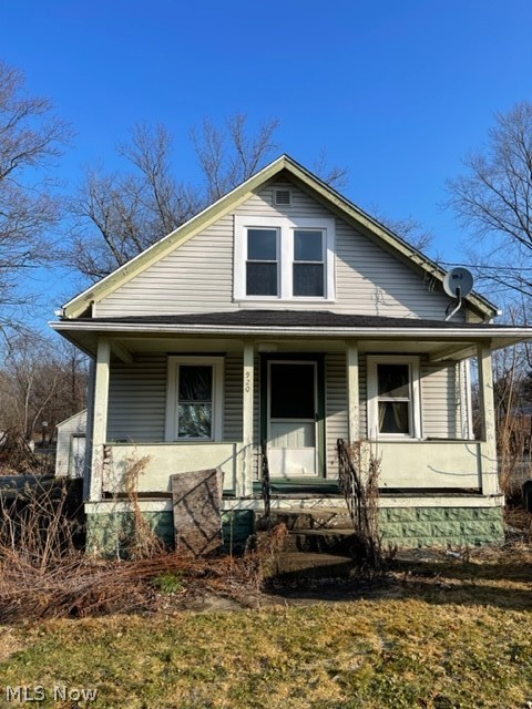 Roomy Cape Cod with 3 bedrooms including fully finished attic, full basement and open lot ready for landscaping. Great potential! Sold As IS.