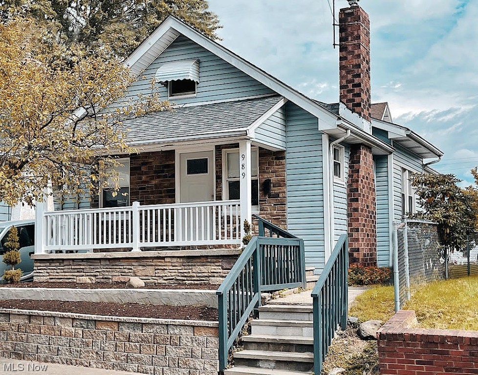 You'll love this delightful, newly-renovated bungalow in one of North Hill's classic neighborhoods. If you like front porches, this 16 ft. porch sets a warm inviting  tone the moment you arrive. The spacious living room opens to the dining room, which will be easy to serve from the light, bright kitchen that's been refreshed with a new sink, tile backsplash, paint, new appliances (including gas stove) and flooring. In fact, there's new flooring throughout the whole main level. You'll appreciate the convenience of having two bedrooms on the main floor, and if you need more room, the 30 ft. bedroom/bonus room upstairs will be great! There's ample room for beds, other furniture and more. The remodeled bathroom includes new fixtures, vanity and a large alcove shower stall with a sharp new surround. The unfinished basement is ready for your touches, and if you like to garden there are numerous planting beds for you to fill. There are two, lovely planting beds in the front, a big garden space in the back yard, and two additional planting spaces along the back of the house. The location is great, too. It's close to schools, all kinds of restaurants and it's close to Rte. 8 for easy access to Canton or Cleveland. Don't let this one get away!