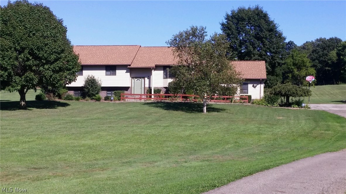 Rare opportunity!  2.41 acres with 3064 sq. ft. home.  5 bedrooms, 3 full baths.  Very open and spacious.  If you're looking for the one, this is it!  Nice bedrooms, two with walk-in closets; three up and two down.  Main floor has open great room to the kitchen, dining and family area with cathedral ceiling. Beautiful cabinetry, nicely laid out to entertain.  Master bedroom has its own master bath and walk-in closet.  Lower level has a huge family room with full bath, laundry room, office and two bedrooms.  Paved driveway with 25 x 25 over sized garage and a barn shed in the rear.    To much to mention here!  This is your forever home!  Call before it's gone!