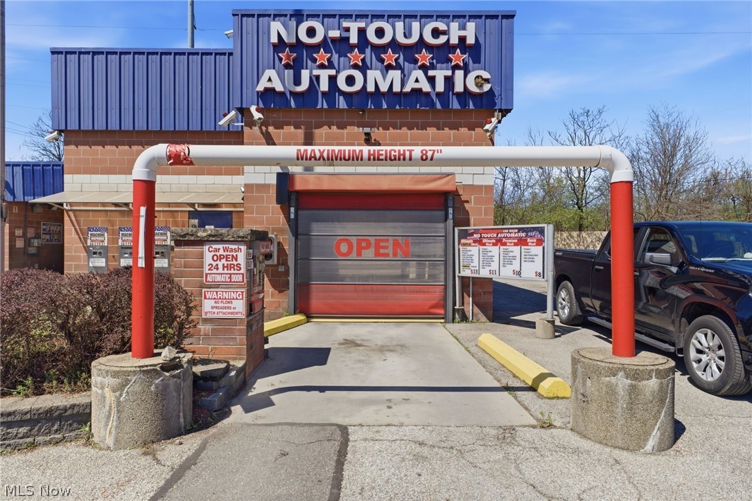 Aqua Clean Car Wash is a turnkey car wash opportunity! Built in 2001 in the city of Cleveland in Cuyahoga County. A fully operational, income-generating car wash positioned in a prime location on a busy, high-traffic location. This comprehensive car wash sits on 0.56 acres. Showcasing 1 automatic bay: 1 No-Touch Automatic Bay (Oasis Typhone). An additional 5 self-service bays and all bays accept cash, credit cards and tokens across bays. The 2026 Technology Upgrade includes a newly installed high-end Point of Sale (POS) system supporting all modern contactless payments, mobile wallets, and encrypted credit transactions. Support Equipment features 9 high-suction vacuums, scent/fragrance machines, and a specialized shampooer. Open 24 hours. Strategic Location: Traffic Counts: Broadway Avenue has approximately 12,800 vehicles per day. Nearby access to I-77, adding significant commuter visibility.  Surrounding Retail: Situated in a high-density automotive and retail corridor. Neighbors include AutoZone, O'Reilly Auto Parts, Advanced Auto Parts, and Tires Plus. It is also close to local staples like Third Federal Savings & Loan and several quick-service food options. Parcel #: 133-27-030A. Utilities: public water, public sewer, forced air, gas, radiant and space heater. Operations are supported by advanced automation and lean payroll requirements, making this a strong fit for both owner-operators and investors seeking a semi-absentee model. With no major capital investments required, this turnkey facility is fully updated, income-producing, and well-positioned for long-term growth in a busy commercial area.