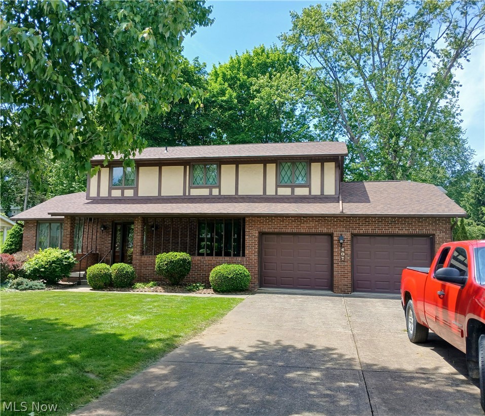 Spacious Tudor styled home in a great neighborhood. Brand new updates include new roof in May, renovated electrical with new box and GFI's, and sewer line upgrades.  Feels larger that square footage indicates. Lovely front porch and family room with beamed ceiling and brick fireplace with bookcases and bay window. Kitchen with Corian counters. This home has plenty of space for the family. It feels larger than stated square footage.  Spacious master suite with walk-in closet and ensuite. Rec room area is large, too. Home needs a decorator's touch to make this a great investment over time,