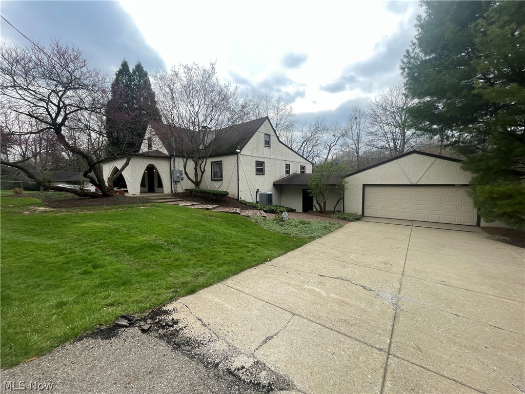 Just Reduced! Liberty Twp. 5 Bedroom 2.5 bath remodeled custom home, 2 car attached, walk out basement overlooking retention ponds with 460' of frontage on Logan Way.  We estimate the living space of this property to be over 3000 SF and the layout is very well thought out.  Large central breezeway bonus room with slider that connects the garage and also provides lower level entrance.  First level features formal large living room with contemporary brick fireplace, updated large kitchen with over size peninsula top, bonus front room that can be eating area or study, large open dining area with maple floors, large family room with slider overlooking water (Caution: slider is dead bolted shut due to fall hazard -this would make exceptional deck location), two main level large bedrooms with updated full bath and updated glass partition shower.  Upstairs are 3 additional bedrooms with half bath.  Lower level features large slider with walk out family room with fireplace, additional full bath, large laundry and connecting bonus room with slider and water views. Large private backyard that is partially fenced. Newer concreate drive with side parking area.  Vector security system. Contents being sold at online auction.  Newer HVAC and water tank. New septic system just installed.  Excellent central location with convenient highway access and retail. Long term owners.  Call any licensed agent for a private showing.
