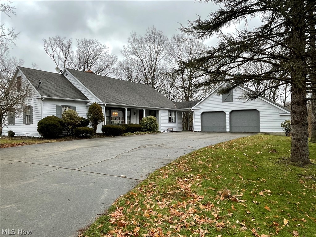 Make sure you don't miss this....For the first time anyone has had the chance to purchase this hidden gem that is close to everything Columbiana has to offer. When building the property in 1970 the seller and the owner of Dunlap homes spared no expense making sure that house had custom solid wood finishes and custom solid wood cabinets throughout, with tons of entertaining space inside and out. The house currently has 3 bedrooms with a complete walk up attic that could be share another two rooms or a giant master suite, complete with a full bathroom. In the kitchen you can enjoy views of outside while cooking your meal to enjoy next to a beautiful large fireplace.  With the house sitting up on the property there is great views of the creek near by and the abundance of wildlife walking through the woods. There is plenty of space to entertain guests with the large back deck and the walk out basement that enters a beautiful area with great flower beds. If you are a car guy or craftsman th