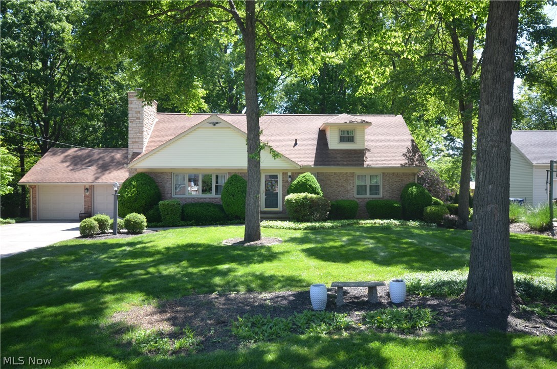 Woodland Estates Brick 5 bedroom, 4 full bath cape with a finished basement and numerous updates. Giant living room w rounded ceiling corners, tons of daylight from the picture window- LVP flooring & a brick woodburning fireplace w mantel & raised hearth. Spacious kitchen w eating area featuring a center island w breakfast bar, cooktop, tile backsplash & beamed ceiling plus a cook top & built in oven. 1st floor laundry w cabinets & access to the back. Beautiful updated full bth w granite counters, tile floor & step in shower. The 1st floor master bedroom has 2 closets, new paint & flooring plus a private master bth w shower & updated sink faucet. Additional 1st floor bedroom w hardwood floors. Upstairs enjoy 3 more bedrooms including one giant room w dormers, ceiling fan, 2 attic storage access points plus a big closet. Full bathroom w shower/tub, tile floor & updated commode & faucet. Whole house attic fan for supplemental cooling, tons of storage including a hall walk in closet w built in cedar chest & 2nd hall closet w 2 hanging bars plus lights in the bedroom closets. The large finished basement adds tons of living space- freshly painted & featuring a brick woodburning fireplace w built in shelving & storage. Large unfinished area for storage, carpentry fan in ceiling, workbench w pegboard & walkout access. The back yard is beautiful & private with a large covered rear patio & a 2 car garage w electric & opener. Updates include: ‘26 Paint (rec rm, master), mst bth faucet & master flooring. ‘25 Upstairs Bth faucet. ‘24 A/C & Thermostat. ‘23 Upstairs commode, Garage doors, Garage opener (further from house) ‘21 HW Tank, Chimney Completely Rebuilt w stone, LVP flooring. ‘20 Front Picture Window. ‘19 Hardwood refinished upstairs bedroom & back corner bedroom, Gutters w screens, downspouts. ‘12 Dimensional Shingle Roof, 1st Flr Full Bth Remodel. ‘11 Windows Throughout, Install hardwood upstairs hallway. ‘08 Electrical Panel.