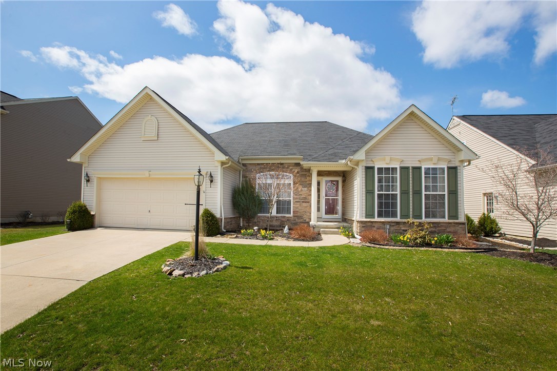 Prepare to be Moved!...Into this fabulous ranch in North Ridgeville! This stunning home is the perfect size to start out or retire in! Step into the open great room with stone fireplace and enjoy watching sunsets over the pond. You'll fall in love with the open floor plan with large kitchen boasting double ovens, countertop range and loads of counter space. All appliances stay! Breakfast room overlooks pond with access to back patio. In addition, there is space for a formal dining or office. French doors lead to the 3 bedrooms. The master bedroom has a beautifully remodeled bath with granite countertops, walk-in tiled shower and newer toilet, sinks & linen closet (2016). Two additional bedrooms share a full bath. Basement has been updated to include fitness room and full bath (2017). Outside, you'll love relaxing on the custom designed stone deck with mature trees providing privacy and beautifully landscaped yard overlooking the pond where you can fish and knack. HOA includes mowing by