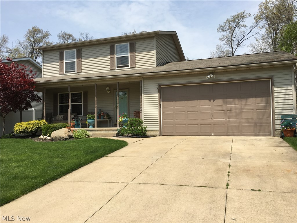 This exceptional 3 bedroom, 1.5 bath home located on a private Cul-de-sac has been well-maintained through the years with much attention to detail.  Easy-care real oak hardwood flooring on the first floor and the newly-remodeled, stunning kitchen offers additional granite counter space makes family living and entertaining a joy. The gas-start fireplace can be viewed from living and dining rooms located in the sunroom addition which opens to a private backyard 14x12 wood deck, 12x22 brick patio, and large backyard for many activities.  Not-to-forget the relaxing 25x6 covered front porch, insulation, and central air.  You will appreciate the cleanliness, fresh baths, nice size closets and good storage throughout.  Attached 2-car garage 28x22 complete with 8 ft high entry door, added organized storage cabinets, water, and service door that conveniently enters the backyard.  Poured 12-course basement ready to finish your way already plumbed for another bathroom (new tub, surround, vanity s
