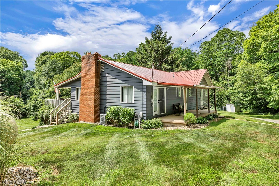 Nestled on 3.3 peaceful acres, this charming 3 bedroom, 2 bath ranch offers the perfect blend of privacy, comfort, and functionality. Enjoy the tranquility of a serene country setting while still being just a short drive from town. Inside, you'll find a warm and inviting layout designed for easy one floor living. The spacious kitchen features ample cabinetry, generous counter space, and convenient access to the dining area, making it ideal for everyday living and entertaining. A dedicated laundry room adds practicality, while the private deck provides the perfect place to relax and take in beautiful views of the surrounding property year-round. The home offers three comfortable bedrooms and two full bathrooms, providing plenty of space for family and guests. The lower level expands your living space with endless possibilities for a recreation room, home office, fitness area, or media room. One of the home's standout features is the unique indoor fireplace, creating a warm and inviting atmosphere to enjoy throughout the seasons. Outside, the spacious backyard is perfect for entertaining, gardening, or simply unwinding in nature. Complete with a 2 car attached garage and plenty of room to roam, this property is the perfect opportunity to experience all that country living has to offer.