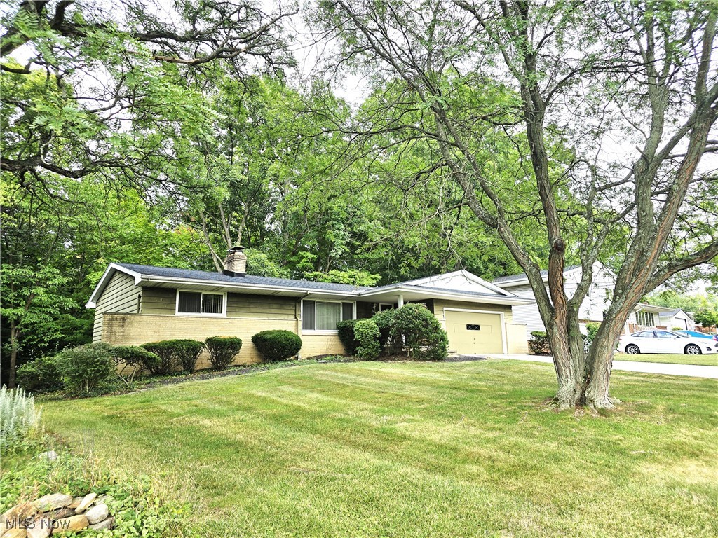 This is the home for you if you are looking for a fixer upper that is reasonably priced & located in a wonderful neighborhood * With 4 bedrooms, 2.5 bathrooms, eat-in kitchen, 1st floor laundry room & a walk-out basement, this home has so much to offer * Hardwood floors are under the carpeted living room, dining room & hall * French doors in the dining room lead out to a second level deck with a wooded view * The lower level offers a very spacious rec room with a stone wall fireplace & wet bar, 4th bedroom, full bath & two nice sized storage rooms with built in shelving * 2.5 car attached garage with hot & cold water spigots * Updates include the Roof, Driveway &  Furnace (installed on 1/03/20) * All appliances remain * So much potential to customize this home to your liking*