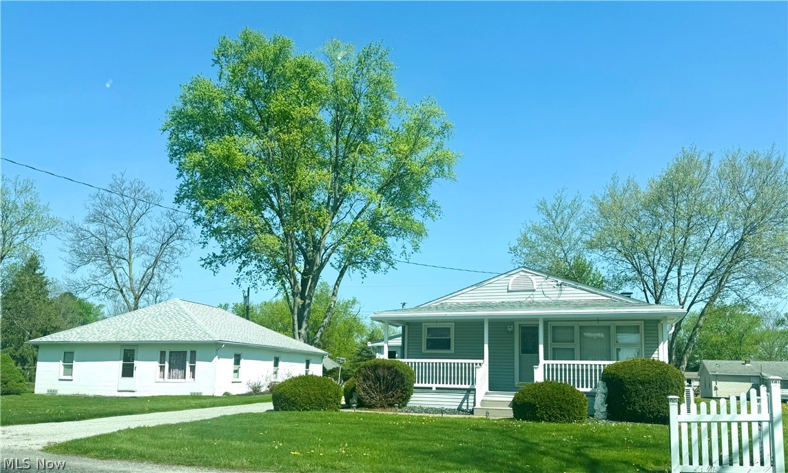 Welcome to this adorable bungalow in Norwayne School District. This charming single-family home is located in the heart of Creston with convenient access to schools and nearby interstate. Numerous updates include: new carpet in living and bedrooms; newer custom blinds; newer mini split provides heating and cooling; newer gas furnace; some newer windows; newer roof shingles (approx. 5 years old).  The basement is partially finished and consists of the laundry area and 3 additional rooms plus a ventless gas heater.  This property contains 2 village lots consisting of approx. .287 acres total. Parcel #1 contains the home and 30x21 detached garage with carport/overhang; a 20x8 3-season room and covered patio. Parcel #2 contains the block storage building which used to be a residence until the 1960's when all mechanicals, wiring, plumbing and walls were removed. This home has been lovingly cared for over the years and is move-in ready, just waiting for you to make it your own!