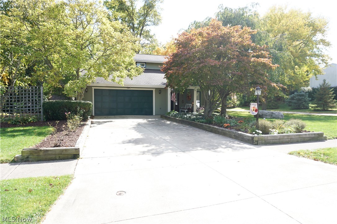 Exceptional Contemporary Colonial with spacious floor plan! Over 2,200 sqft. 3 bedroom and 2.5 baths. Inviting kitchen with plenty of counter space, cabinets, wine rack and plenty of natural light with a sliding door leading out to stamped patio over looking a very private, scenic wooded lot ! Formal dining room, Family room with a beautiful fireplace. Living room with vaulted ceilings, first floor Laundry room with convenient  countertop, sink and cabinets. Spacious Master bedroom accented with a fireplace and beautiful decorating with large walk in closet, Master bathroom with ceramic floor and shower, Granite counter top on vanity. 2 additional bedrooms and Hallway full bath that is absolutely gorgeous, completely new in 2019 ! Excellent lower level Family room great for entertaining. Plenty of storage area on other side of the basement. 200 amp electric service. Extra wide 2.5 car attached garage. Many new updates in this fine home include Newly constructed over sized back yard she