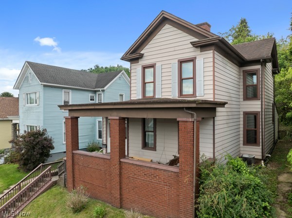 Welcome to your next chapter in the heart of the Ohio Valley! This charming two-bedroom, two-bathroom home is ready to steal your heart — and possibly your weekends, because you'll never want to leave.

Step inside and discover two oversized bedrooms that give you room to stretch out, dream big, and maybe even fit that king-sized bed you've been eyeing. Both bathrooms have been thoughtfully updated, blending modern style with everyday functionality. The large eat-in kitchen serves as the true heart of this home, offering plenty of space for everything from weeknight dinners to ambitious Sunday brunches.

When the weather calls you outdoors, the back porch is your perfect retreat. Fire up the grill, settle into your favorite chair, and enjoy quiet evenings under the open sky. It's the kind of space that turns neighbors into friends and dinners into memories.

Location is where this home truly shines. With convenient access to Interstate 70 and Route 7, commuting is a breeze. The vibrant city of Wheeling, West Virginia is just minutes away, offering shopping, dining, entertainment, and cultural attractions along the waterfront. Head west to discover the charming community of Saint Clairsville, with additional shopping and small-town appeal. With neighborhood improvements on the horizon, this area is poised for positive change.

Whether you're a first-time buyer, looking to downsize, or searching for a solid investment, this home checks all the right boxes. Schedule your showing today before someone else grabs the keys!

Selling AS IS with right of inspection. Home next door (419 Whitely) is on the land bank 2026 demolition plan - see supplemental docs