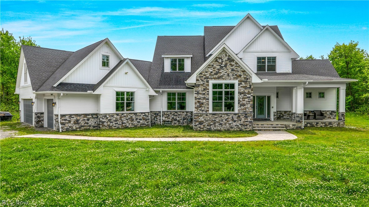 Custom built estate completed in late 2023 on nearly 7 private acres in Eaton Township with a 250 foot setback, backing to protected Metro Parks land, and extensive smart home integration throughout. This 4 bedroom home offers over 4,500 sq ft of thoughtfully designed living space with high end finishes and modern luxury features.
The gourmet kitchen features Dolomite countertops with a book matched backsplash, custom cabinetry, an 8 burner Forno gas range, matching appliances, a prep sink, smart faucet, pot filler, and a walk in pantry. Anchoring the home's open concept design, the kitchen flows into the morning room and main living areas, while a butler's pantry connects to the formal dining room, highlighted by custom solid wood wainscoting.
The first floor master bedroom features vaulted ceilings, while the adjoining bath includes heated tile floors, a walk in shower, freestanding soaking tub, dual vanities, mirrors with built in lighting, and a large custom walk in closet system. Convenient first floor laundry complements the main level layout.
The second floor includes 3 bedrooms and a full bath. Above the heated garage, a bonus suite offers two additional rooms, a half bath, and access from both the mudroom and garage. The basement features access from the house and garage, is plumbed for a full bath, and offers future finishing potential.
Additional highlights include solid clear grade hickory flooring by Sheoga Hardwood Flooring, 8 foot solid interior doors, custom woodwork throughout, a gas fireplace, whole home audio, and a fully integrated Savant smart home system controlling lighting, HVAC, audio, security, cameras, locks, and more.
Exterior features include covered porches, stamped concrete patio and walkways, a whole house backup generator, exterior security lighting that automatically activates during power outages, and full exterior camera coverage.
Don't miss this rare opportunity. Schedule your private showing today.