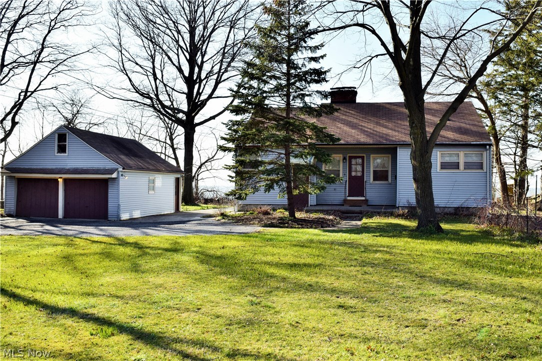 Waterfront home for sale in Lakeline Village sits on a generously sized property. Enjoy year-round backyard panoramic views of Lake Erie! Have a lakefront picnic in the backyard or lounge in the sun room with 3 walls of windows for maximum views. In the winter, stay cozy in front of the fireplace and take in the breathtaking, icy waterscape from the family room picture window. This 1.5 story, Cape Cod style home has 2 bedrooms on the main floor, each with their own attached half baths. The 3rd bedroom is upstairs, with its own half bath and fireplace. The basement is partially finished with a rec room, bar area, and fireplace, adding 400+ more square feet of living space! Two parcels are included, 30A0030000080 and 30A0030000090, for a total lot size of 98' X 457'. So many options for buyers: move in, remodel, or build your new dream home on the 1.02 acre property!