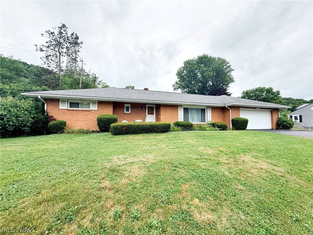 This spacious 3BR, 2BA brick ranch is a timeless beauty with so much character and charm. As soon as you enter you will be impressed with the quality and space the home has to offer. The bright living room boasts tons of natural light from the large picture window flowing into the kitchen with white cabinetry and stainless appliances. Just off the kitchen is the first floor family room and access to the two car attached garage for easy one level living. Three nicely sized bedrooms with large closets and two full baths to give everyone the space they need. This home offers so much flexibility with main level and basement level laundry options. The full basement is ready for to be used to be finished for additional living space and loads of storage. Situated on an almost 1 acre lot in park like setting.