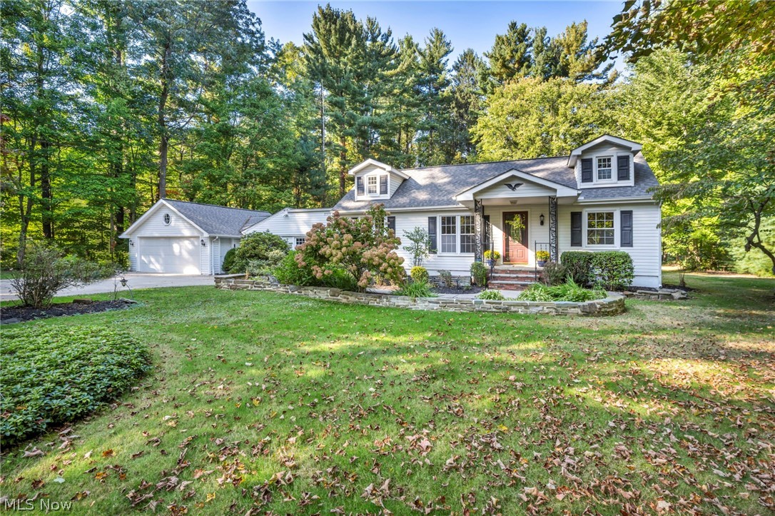 Nearly an acre, 5 bedrooms or 4 bedrooms with den, and move in ready in Willoughby Hills, this is the one you’ve been waiting for. Tucked beneath a canopy of mature trees, this home offers approximately 2,485 square feet of refreshed living space, blending timeless charm with thoughtful updates and ready to enjoy this summer. Inside, sunlit picture windows frame serene wooded views, while the flowing layout connects living, dining, and kitchen spaces for effortless everyday living and entertaining. A fireplace anchors the family room, adding warmth and character. With main level bedrooms for flexibility and additional bedrooms plus a loft-style landing upstairs, this home in Willoughby Hills adapts to how you live, work, host, and unwind. Step outside to multiple porches, a private patio, and nearly an acre of usable land, plus a detached outbuilding ideal for hobbies, storage, or recreational space. Surrounded by over 200 acres of parkland, including Hach-Otis Sanctuary State Nature Preserve, and just minutes to shopping, dining, and schools this home delivers privacy, nature, and convenience in one rare opportunity. Schedule your private showing today homes with this setting, space, and flexibility don’t last.