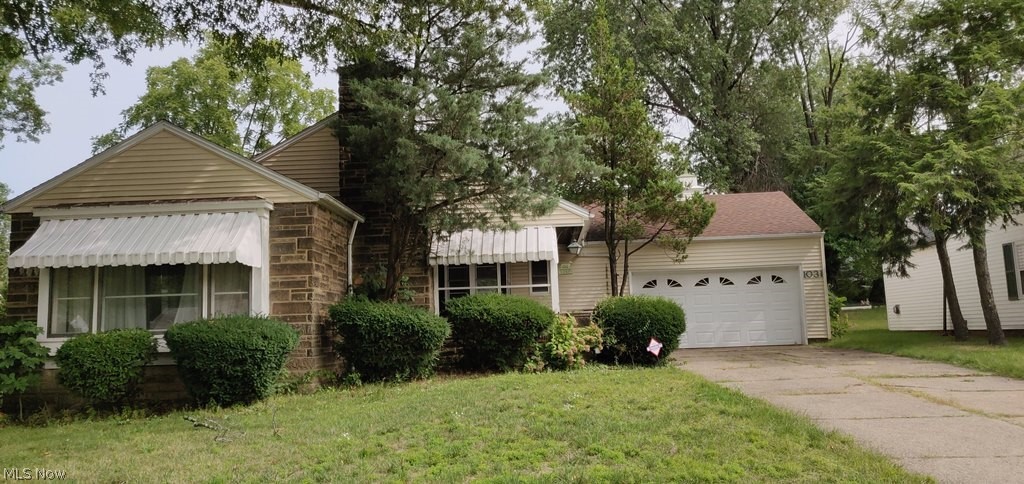 Tons of natural light and beautiful wood floors throughout, 2 car attached garage, spacious yard, full basement and so much more.  Close to all that Cleveland Hts has to offer.  Come and make it your own today!