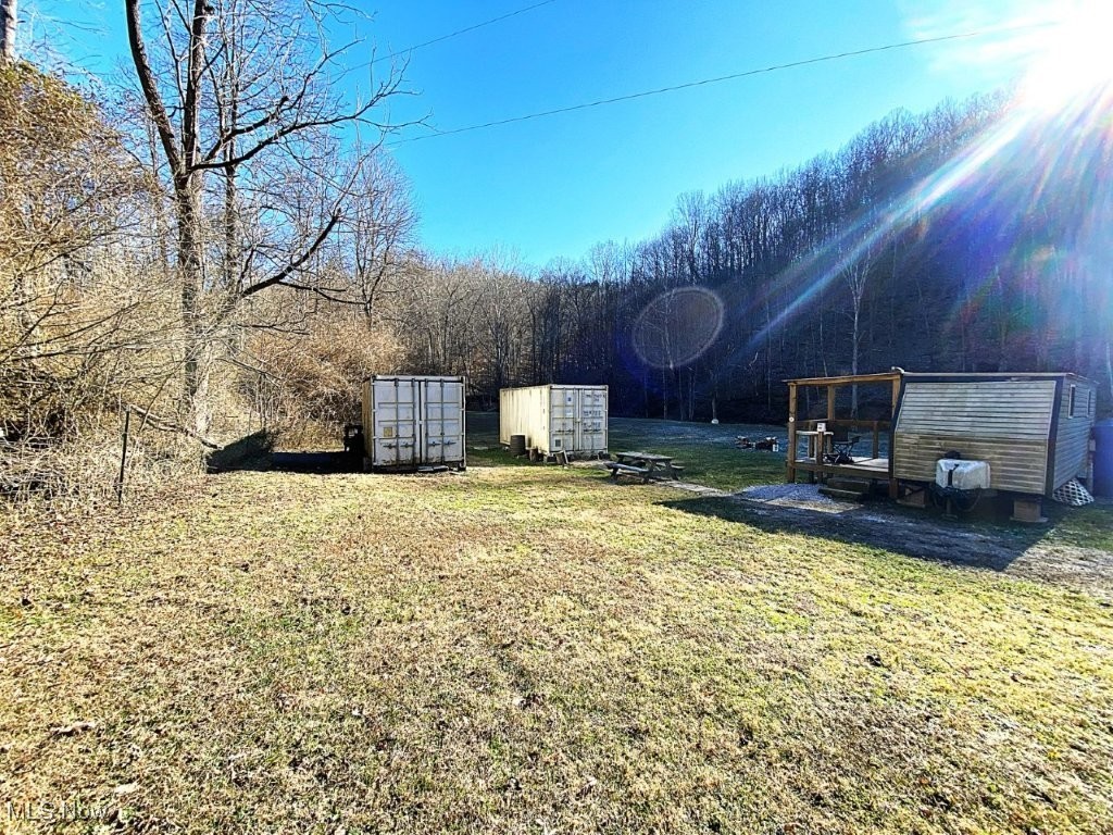 Exceptional 130 Acres! This property has much to offer. Easy access with locked gated entry. Large level area features 20ft. camper with porch, electric. 2-20ft. shipping containers. Water well for outdoor use. Old cellar. Large level garden area. Space for a favorite livestock pet(s). Green Creek flows thru property. MATURE TIMBER! Quiet location great for family fun or excellent hunting camp. Wildlife abounds. Intriguing rock formations to explore, top of ridges. Property is located on both sides of the road divided by Kettle Road. Come see and enjoy all this mostly wooded property with trails has to offer. Hunting, camping, exploring, hiking, trail riding, ATV, UTV ride for miles from this property on back roads. Enjoy nature at it’s best, Moon and Stars at night. Must see to appreciate. Contact listing agent for details.