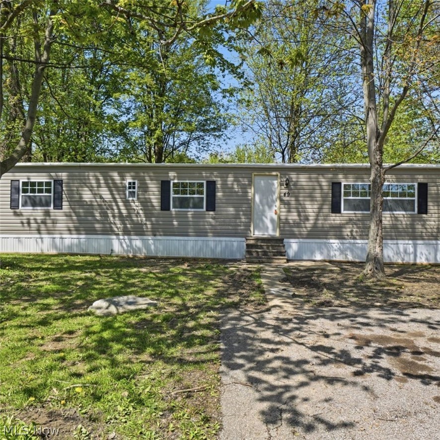 Featuring all-new siding, energy-efficient windows, stylish flooring, and fresh paint throughout, all that's left is for you to move in! With major exterior and interior improvements already completed, you can enjoy peace of mind and low-maintenance living from day one. Don’t miss your opportunity to own a renovated home in an easy living community!