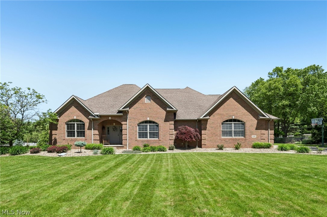Welcome to this sprawling, brick-front ranch in the highly desirable Carrington neighborhood, where comfort, style, and convenience come together in a bright, move-in-ready home! A covered front porch welcomes you into an open and airy floor plan featuring high ceilings, decorative arched entryways, and abundant natural light throughout.

Entertain in the formal dining room, showcasing a tray ceiling, elegant wainscoting, and a large arched window, creating the perfect setting for gatherings.

The spacious living room features a vaulted ceiling with skylights and a gas fireplace, flanked by windows.

The gourmet kitchen is designed for both functionality and style, offering extensive cabinetry, a large center island/breakfast bar, stainless steel appliances, and a dining area with access to the backyard.

French doors lead to the primary suite, boasting a vaulted ceiling, generous walk-in closets, and an ensuite bath featuring dual vanities and a jetted tub.

Two additional bedrooms and a full bath with double sinks provide plenty of space for family or guests.

The unfinished basement offers endless possibilities for future living space, recreation, or storage.

Situated on a beautifully landscaped .56-acre lot, the property also features a stamped concrete patio and an attached two-car garage.

Residents enjoy access to Carrington's private walking trail, all within the sought-after Jackson Local School District!