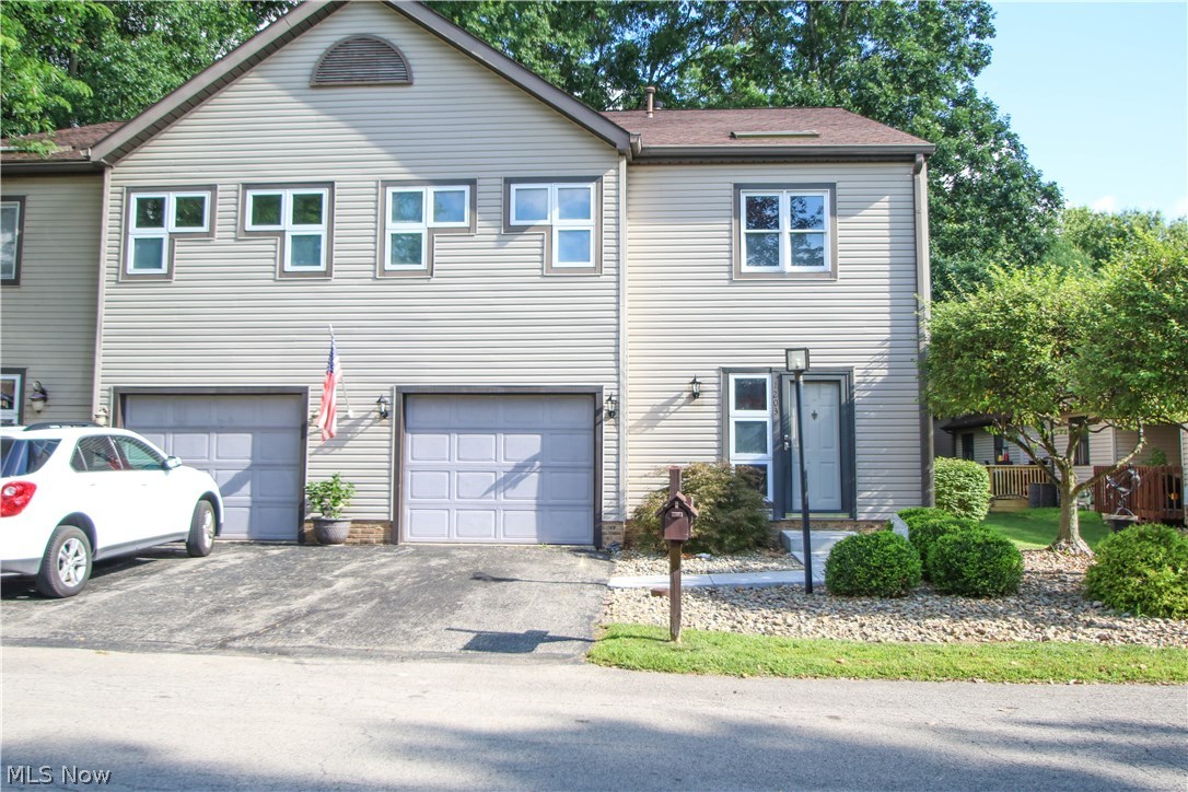 Beautifully updated 2 bedroom townhouse in Howland schools. This condo has a custom layout. Large foyer space greets guests and opens in to a formal living room with gas fireplace, vaulted ceilings, and sliding glass doors to the back deck with sun setter awning, and common yard area. Updated kitchen provides lots of cabinets and counter tops, new flooring, new appliances including an Advantium oven- making any home cook look like a chef! A large dining space is adjacent to the open kitchen. 1st floor laundry (washer & dryer hook ups are also in basement for your choice of laundry room location) and half bath. The 2nd floor boast 2 master bedroom suites and a lofted sitting room, (could be a nice home office space). Both bedrooms have large closets and full en-suite bathrooms with antique vanity cabinets- you’ve got to see the French doors, and jetted jacuzzi soaking tub in the larger bedroom!
Full basement is finished with a family room, and utility/ storage room. Attached garage. Up