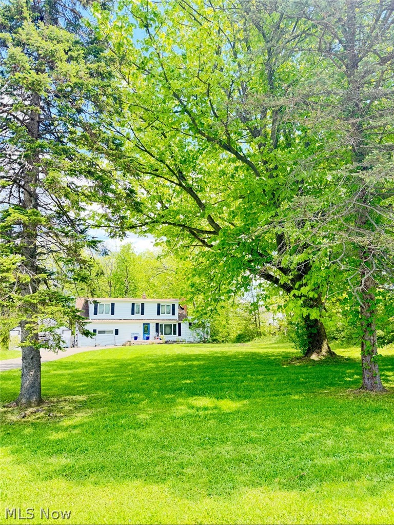 Location, Location, Location! Nestled in the heart of Kirtland, Ohio, this charming farmhouse offers the perfect blend of classic character, modern convenience, and an unbeatable location. Unbridled nature and charm this home is centrally located between three of the area’s most beloved outdoor destinations: The Holden Arboretum, Penitentiary Glen Reservation, and Lake Metroparks Farmpark. If you are looking for a home in a great school district and great location–here it is! This home is ideal for nature lovers seeking peaceful living with easy access to scenic trails, educational experiences, and year-round recreation.
This beautiful 3-bedroom farmhouse features a thoughtfully designed layout with everyday convenience in mind, including first-floor laundry, a full bath on the main level. There is an open dining room to living room that has wonderful light and flow. The den and living room both have fireplaces. There is another large bonus room that is beautiful, bright, and airy. The three bedrooms and a second spacious full bath are upstairs.
Outside, enjoy a 2-car garage, a fully fenced backyard with privacy fencing, and a deck perfect for relaxing, entertaining, or enjoying quiet evenings outdoors. Combining farmhouse charm with practical amenities and a prime location, this Kirtland gem offers a wonderful opportunity to enjoy comfort, privacy, and the best of Northeast Ohio living.