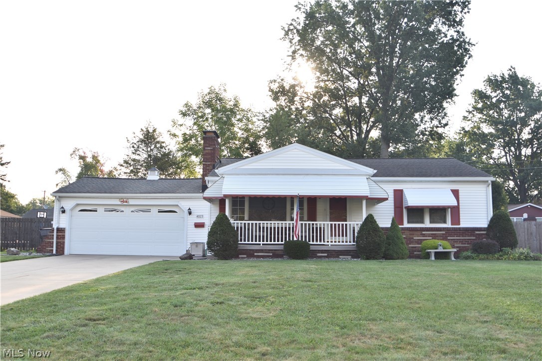 Nothing to do but move in!  Vinyl sided ranch home on a quiet dead-end street.  Living room and large great room, full basement with a finished rec room and bedroom.  Kitchen is equipped with all new appliances.  Newer windows.  There is extra storage (workshop) in the 2 car attached garage.  Backyard patio with fenced backyard.  Lovely covered front porch.