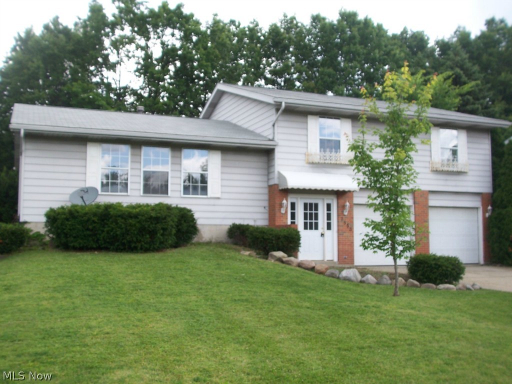 A remarkable split level in Sherwood Acres.  This 4 bedroom 2.5 bath home has over 2600 square feet of total living area.  The basement is finished with a  21x15 rec room, additional bonus room, and finished laundry room.  The family room has a fireplace, and opens to the private back yard.  The new kitchen has granite counter tops and ceramic floors.  The flooring throughout the home is new.  The many interior updates include:  carpet, ceramic, fixtures, paint, 1/2 bath, electric, and much more.