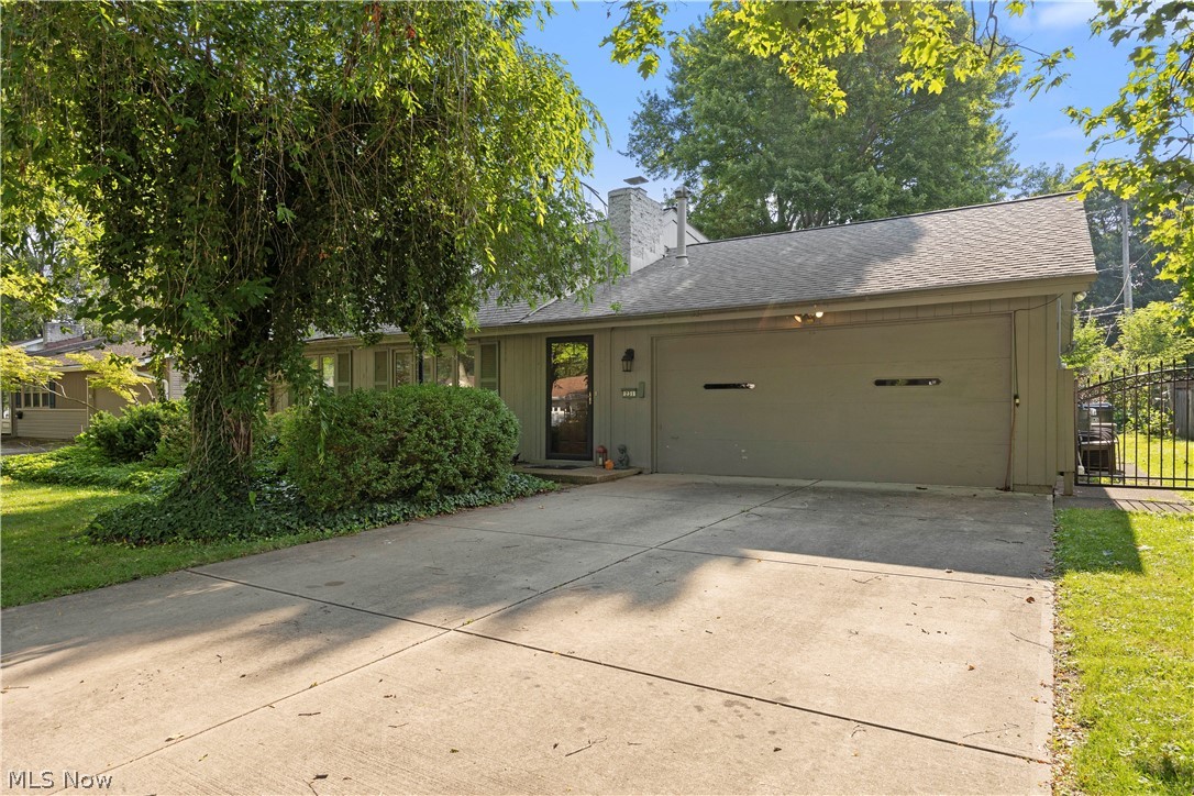 Don't miss this rare opportunity to own a distinctive Bob Schmidt-built home in the heart of Berea! Originally built as a ranch, this unique home was expanded with a rare second-story addition, offering **four true bedrooms** and versatile living space. The upper level features a private bedroom, dedicated office with impressive floor-to-ceiling built-in bookshelves, and additional storage. The inviting living room boasts a gas fireplace, while the kitchen offers the charm of a rare wood-burning fireplace. Vaulted ceilings and skylights fill the home with natural light, creating an open, airy feel throughout. The main level includes three bedrooms, including a spacious primary bedroom with a large walk-in closet, a full bath with a walk-in shower (approximately 10 years ago), and a convenient half bath. The formal dining room features a walk-in pantry for exceptional storage. Relax in the three-season room overlooking the fenced backyard with patio and an Amish-built shed complete with a loft. Additional storage is found throughout the home, including pull-down attic storage above the attached two-car garage. Just minutes from Baldwin Wallace University, Coe Lake, the Cleveland Metroparks, shopping, dining, and major highways. **A rare chance to own an expanded Bob Schmidt-built home offering space, character, and endless possibilities.** Being sold **AS-IS**, with no repairs to be made by the seller. List price reflects the property's current condition, presenting an outstanding opportunity to make this special home your own.