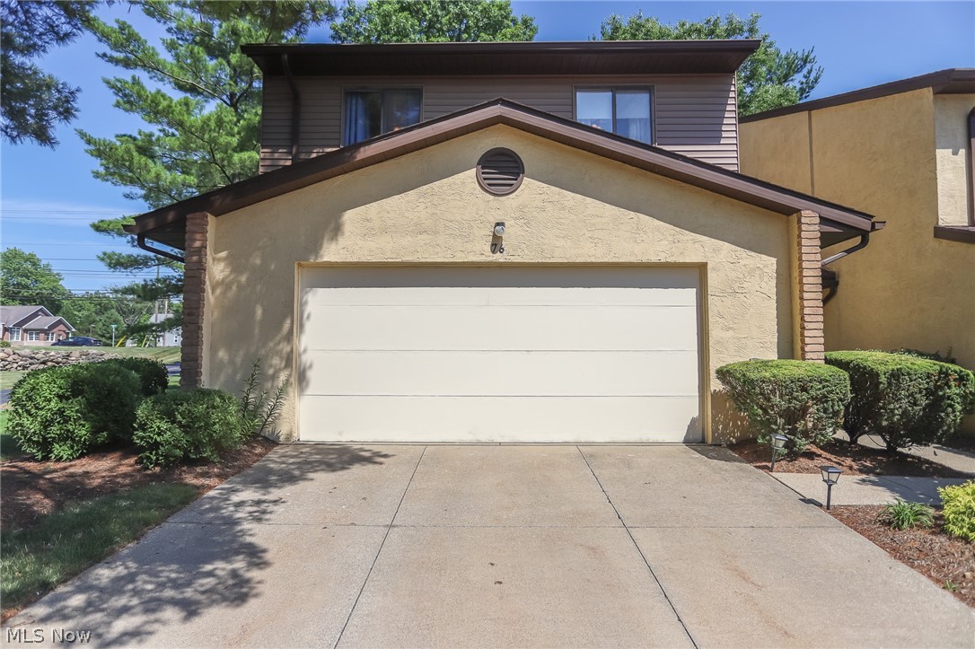 A remarkable end unit Munroe Falls condo with 3 bedrooms and 2.5 baths.  This updated unit is over 2000 square feet, and features an open concept with a two story  great room with a built in bar.  There are 2 fireplaces, with one in the open kitchen sitting/family room.  The updated kitchen has wonderful wood block counter tops, newer cabinets, stainless steel appliances, and a nice sized eating area.  The baths are all updated, and there is a first floor laundry. The bedrooms are all large, with a full master suite with double sinks.  An attached 2 car garage, additional parking, a patio, and so much more.