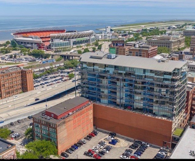 A rare opportunity awaits to elevate your lifestyle in this downtown Cleveland luxury condominium.  Perfectly positioned on the 5th floor suite 503 at The Pinnacle offers stunning views of Lake Erie and beyond. An ever changing backdrop through floor to ceiling glass, and a private outdoor inset terrace. This exceptional suite offers approx. 1800 sq. feet of living, relaxing, and entertaining spaces. Open seamless flow concept design keeps you connected to friends and family. Gleaming hardwood flooring, custom recessed lighting, and an MCM inspired beamed ceiling treatment enhance this suite's luxury vibe. A custom curved bar accommodates generous seating in the culinary center, black polished stone surfaces, graphite stainless appliances, custom cabinetry, and unique lighting enhance the space. Two primary bedrooms with spa-like bathrooms, one equipped with a steam shower, generously sized, are sure to impress. Walk-in closet area and an abundance of storage options. Stunning artful wall treatments in both primary bedrooms add to the overall modern aesthetic. Suite 503 offers two indoor parking spaces. The location of these 2 parking spots are another rare offering, they are outside your front door. The Pinnacle offers its owners a 24-hour equipped gym, yoga rooms, steam sauna rooms, high security with 24 hour reception desk. Sleek modern lobby and a roof top garden pet friendly building offering a large fenced dog run. Suite 503 offers a maintenance free lifestyle at The Pinnacle. One of Cleveland's finest!