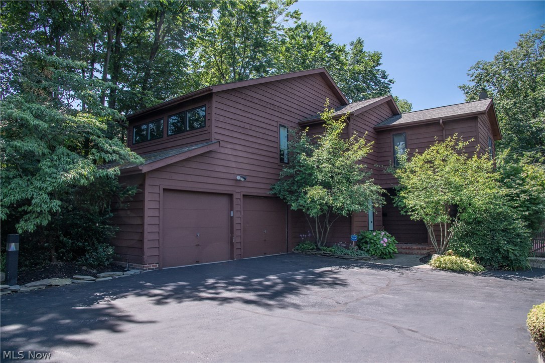 Rare 3 bedroom, 2 1/2 bath stunning contemporary colonial home, located in the heart of the Heights within walking distance to University Circle, shopping and restaurants. Easy access to downtown, Cleveland Clinic and University Hospital. The home is entered via a private drive with three other homes. The entrance foyer offers an open staircase. The step-down living room has hardwood floors, fireplace, built-in bookshelves, vaulted ceiling with skylights and a wall of windows. The dining room overlooks the completely revamped rear yard. The white kitchen with generous counter and cabinet space and breakfast bar opens to the family room with a slider leading to the expansive deck. Step onto the large deck overlooking the fully-fenced in and professionally landscaped private yard. A very large laundry/utility room with access to the two-car heated attached garage round out the first floor. Upstairs, you’ll find a large master bedroom suite that is entered through a private corridor. Ther