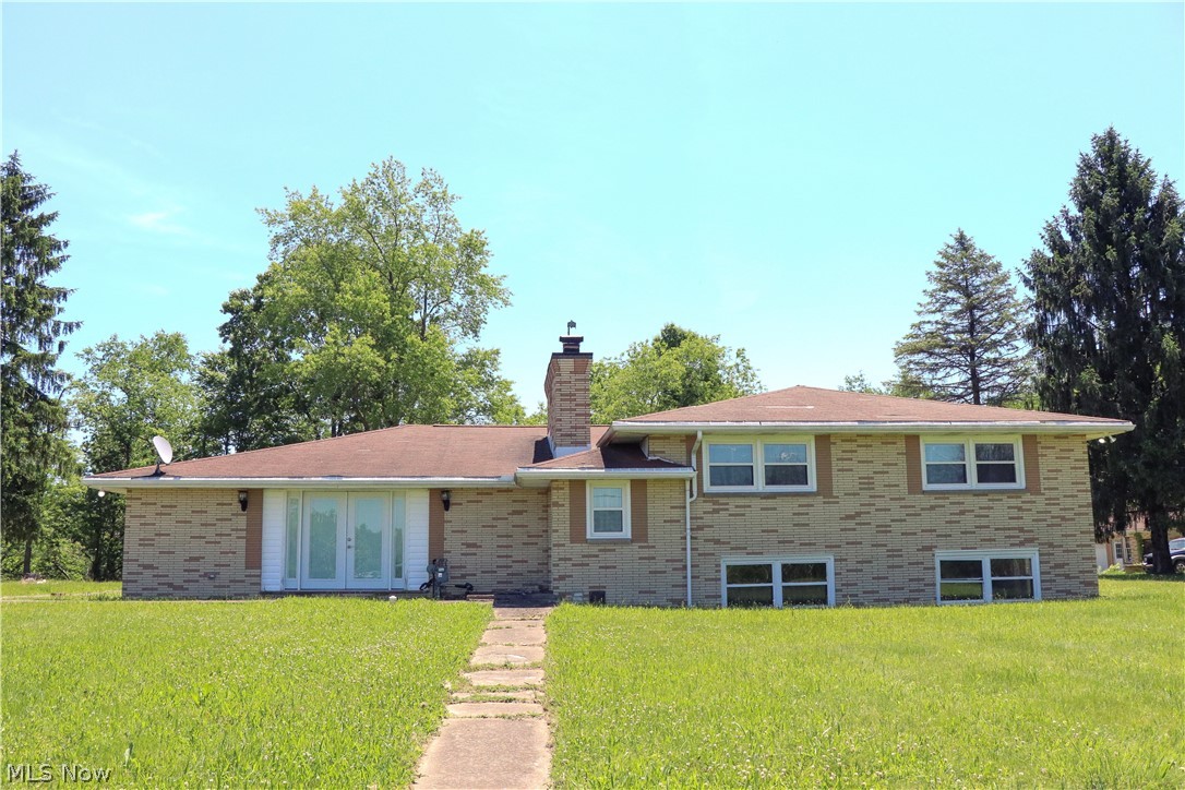 Escape to the country in this fully renovated 4-bedroom, 2-story home on 3.8 private acres. Blending modern farmhouse style with peaceful country living, this move-in-ready property features an open-concept main-level with hardwood floors, abundant natural light, fresh paint, a custom fireplace, and a beautifully updated kitchen with a large center island, stainless steel appliances, premium countertops, and custom cabinetry. The spacious primary suite offers a soaking tub and walk-in closets. The lower level provides ideal in-law or guest quarters with a living area, second kitchen, bedroom, and updated bath. Enjoy the oversized covered back porch overlooking the scenic acreage.