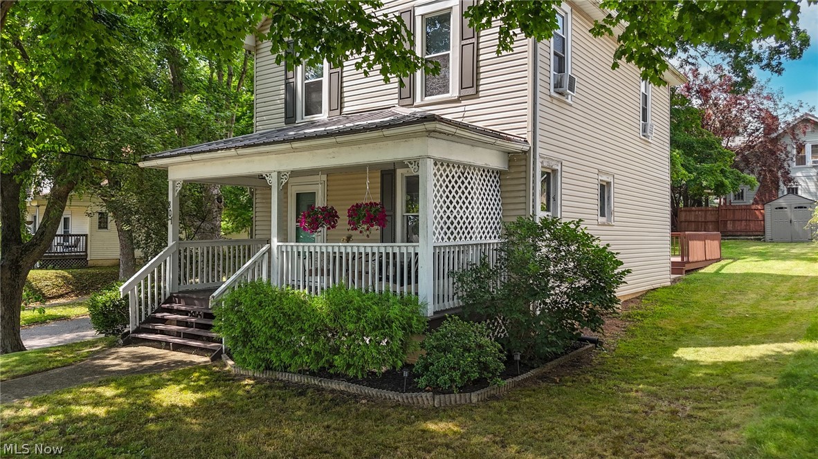 Welcome home to this charming and well-maintained 3-bedroom, 1-bath home offering 1,232 square feet of comfortable living space. Full of warmth and character, this home features hardwood flooring, fresh paint, updated light fixtures, and a tastefully updated kitchen and bathroom. Newer furnace and roof offer peace of mind too! The inviting living room is centered around a cozy fireplace insert surrounded by custom built-ins, creating the perfect space to relax or gather with family and friends. A dedicated dining room provides plenty of room for entertaining and offers a decorative fireplace and direct access to the large rear deck, making indoor and outdoor living a breeze. Enjoy your morning coffee or unwind in the evening on the beautiful covered front porch overlooking the neighborhood. Situated on a corner lot and set up from the road, this home offers an attractive setting with added curb appeal. Off-street parking provides convenience, while the spacious back deck is ideal for cookouts, entertaining, or simply enjoying the outdoors. Whether you're a first-time homebuyer, looking to downsize, or searching for an investment opportunity, this move-in-ready home is one you won't want to miss!