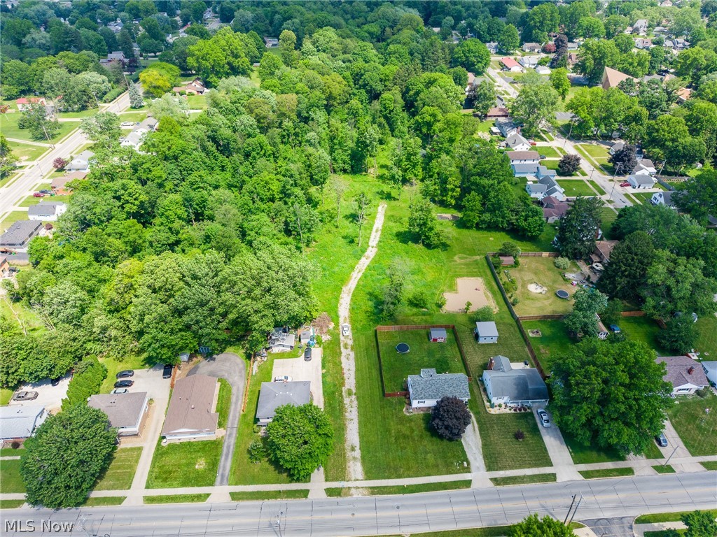 This property is an online only absolute auction that is ending July 15th at 5pm. The price stated is not a listed price and is not anything other than an appraisal on the auditor page.

Exceptional opportunity to purchase 5.44 acres in the City of Rittman with outstanding development potential. Located on Metzger Avenue directly across from the elementary school, this property offers a rare combination of convenience, privacy, and buildability. 

The parcel features a mix of open ground and mature woods, creating a peaceful setting that feels far removed from the city while still providing easy access to everyday amenities. A scenic creek runs near the rear of the property, adding character and natural appeal. 

The property is zoned R-2, making it an attractive opportunity for developers, builders, and investors seeking residential development potential. Whether you're considering single-family homes, duplexes, or a larger residential project, buyers should perform their own due diligence with the City of Rittman regarding permitted uses, development requirements, and approvals. One of the property's most appealing features is the availability of city utilities, including water, sewer, natural gas, and electric, providing a strong foundation for future development. Despite its convenient in-town location, the wooded surroundings and natural landscape create a private, country-like atmosphere that is difficult to find within city limits.