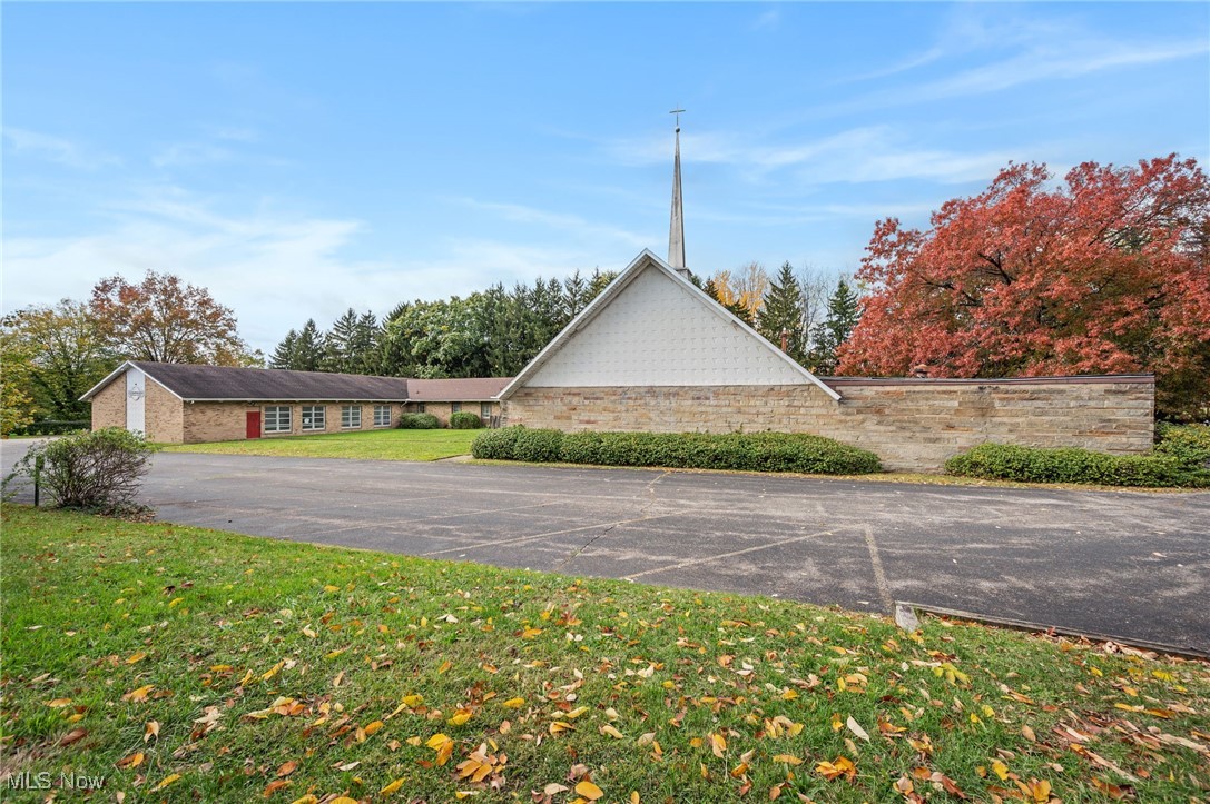 This church property presents an exciting opportunity to breathe fresh life into a spacious and thoughtfully designed facility. It can continue its legacy as a religious institution, or be repurposed for community-oriented use such as a daycare, private school, or nonprofit. With its generous size and two distinct wings, it would be easy to maintain one wing as a place of worship while dedicating the other wing to a separate purpose, and leasing the space.

The sanctuary spans an impressive 2,663 square feet, featuring vaulted ceilings and elegant symmetrical LED and tray lighting. This space includes a built-in stage, a projector and sound system, and pianos that remain with the property, making it well-equipped for services, performances, or large gatherings. There's a dedicated baptismal area behind the stage. This wing of the church also features a nursery and several other versatile rooms, offering flexibility for meeting spaces, offices, or classrooms.

The main entrance opens into a large breezeway, serving as a central hub that connects both wings of the building. To one side lies the sanctuary wing, and across the breezeway, the secondary wing unfolds into a long hallway lined with classrooms and offices on each side. At the end of the hall, there's a kitchen and large multi-purpose room that could easily function as a cafeteria, fellowship hall, or community gathering space. The multi-purpose room connects to another large room with its own stage, providing even more options for events, performances, or youth programs. Outside, an oversized garage offers space for vehicles, storage, or equipment.

While the building needs work, it remains structurally sound. The owners will not make any repairs. The property is being sold strictly as-is. An inspection report and additional photos are available upon request. Buyers to conduct their own due diligence. The owners are not interested in seller financing, and will not entertain offers with those terms.