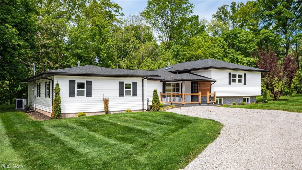 Completely renovated 4-bedroom, 2.5-bath bi-level conveniently located near shopping, dining, and other local amenities. Situated on 1.49 acres, this property offers a spacious yard with room to enjoy the outdoors. The home features an open-concept layout with a spacious kitchen offering quartz countertops and modern finishes throughout. A bonus room provides additional flexible living space for an office, playroom, or hobby area. Major updates include all new electric, plumbing, and HVAC, making this home move-in ready with plenty of space both inside and out