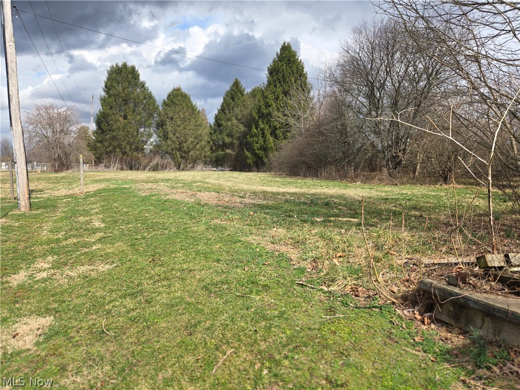 This beautiful property sits on two parcels and is over 3/4 of an acre. You are surrounded by mature trees making this lot feel even more private. The majority of the lot is level ground and ready for your new home! The lot features public water, sewer, electric, and natural gas, making it ideal for you to hit the ground running with your dream home. Located on a quiet street and just 10 minutes from South Zanesville and just one hour from the heart of Columbus! The lot comes with existing structures including a 16x20 Barn and with stairs to the loft as well as a 24x24 block garage. The 1978 mobile home located on the property is in need of removal or significant repair, however, the block foundation it sits on appears to be in good condition and could possibly be used for a new manufactured or stick built home. Reach out to your favorite real estate agent today to schedule a private showing and you could very soon, be enjoying everything this property as to offer!