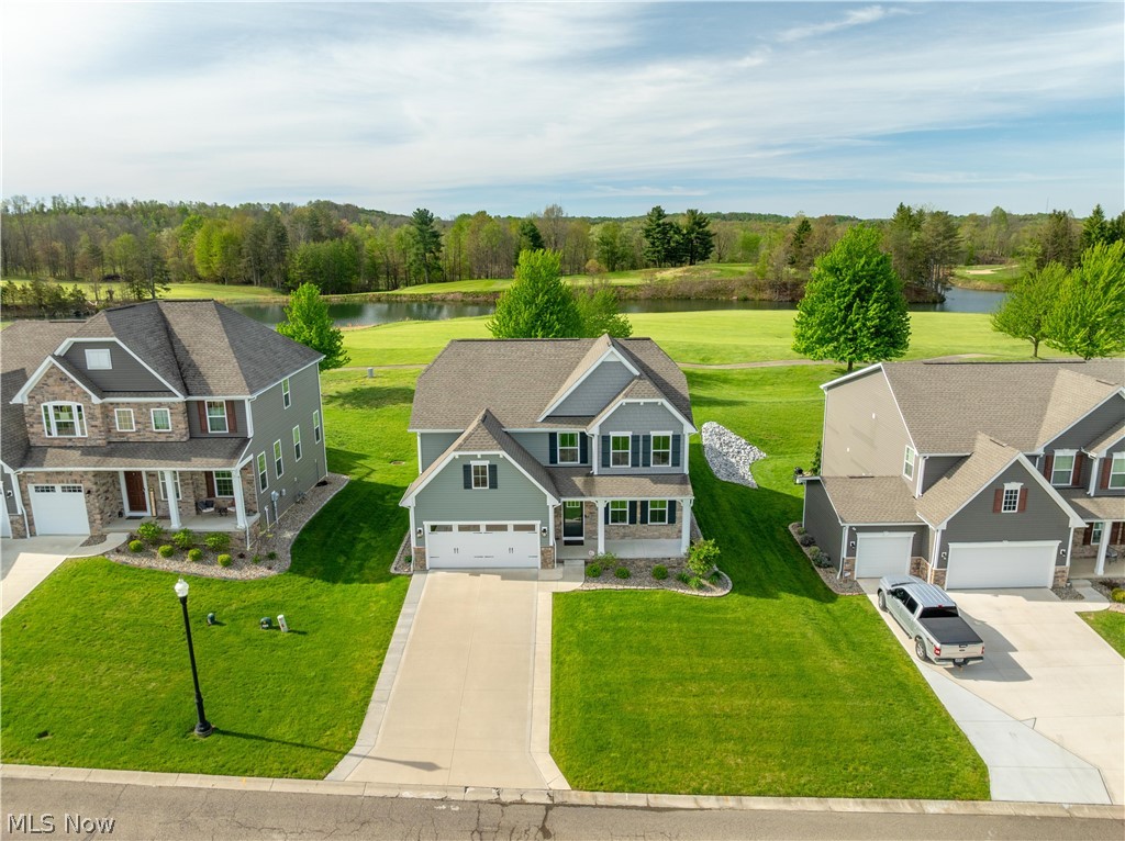 Golf Course Living at Its Finest! Nestled on the 18th hole of The Quarry Golf Club, this freshly painted spacious 3-bedroom, 2.5-bath home boasts 2,440 square feet of well-designed living space. The open floor plan seamlessly connects the heart of the home—a stylish kitchen complete with quartz countertops, ample cabinetry, a walk-in pantry, custom backsplash, underlit cabinets, and an inviting dining area that can easily double as a home office or playroom. The first-floor primary suite is a true retreat, featuring a tray ceiling, an en-suite bath with a walk-in shower, and a spacious walk-in closet. Nearby, a convenient first-floor laundry/mudroom leads to the 2-car garage. Upstairs, you’ll find two generously sized bedrooms, a full bath, and a versatile bonus area currently used as a second living room. An unfinished basement, plumbed for a full bath.  Enjoy the serene golf course views from the beautiful covered porch,—a perfect extension of the living space for relaxing or entertaining. And for piece of mind, the home offers a whole house generator. This home combines the best of comfort and lifestyle in a sought-after community. Don’t miss your chance to experience life at The Quarry! Partial tax abatement in place until 2036, with current yearly taxes of just $2,533. Plus, enjoy the unparalleled amenities offered by The Quarry community, including golf, a pool, exercise room, and bar/restaurant. The monthly HOA fee of $240 covers mowing, landscaping, snow removal, irrigation, pool maintenance, and access to the fitness center. Golf memberships are available but not required.