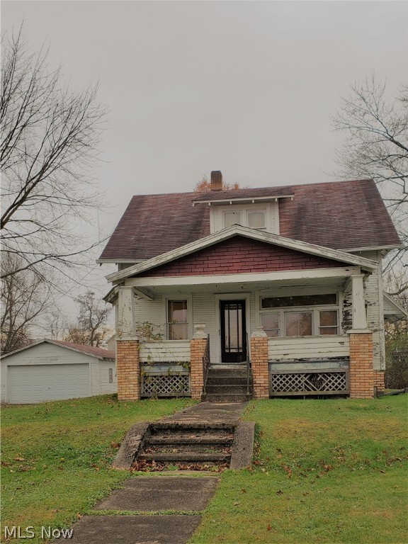 Opportunity awaits! Here is your next project!! Large city lot, nice location. Home with 2 car detached garage. All city utilities. Sold "AS IS".