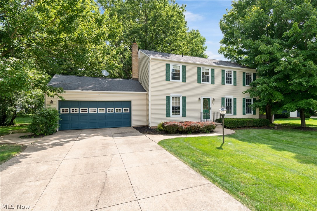 Welcome home to this spacious Colonial in Frashure Park Estates within the Norton Local School District. This 4-bedroom, 2.5-bath home offers 1,976 sq ft and was built in 1978. The main level includes a living room with crown molding and double front windows, half bath, and an open kitchen featuring Thomasville cabinets, granite countertops, stainless steel appliances, glass-front display cabinets, and two pantry cabinets with multi-racks and pull-out shelving. The kitchen opens to the family room with a wood-burning fireplace and newer sliding glass door leading to the deck and backyard with mature trees. The second floor features a primary bedroom with ensuite bath, dressing area, and walk-in closet. Updated main bath with large shower. Second bedroom includes its own sink, mirror, and double closets. Two additional bedrooms complete the second floor. Full unfinished basement provides ample storage. Updated furnace, central air, and electric panel. Attached 2-car garage with concrete driveway. Schedule your private showing today.