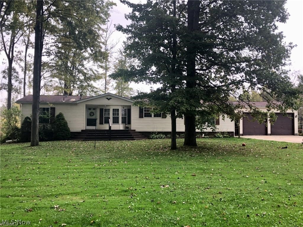 Charming 3 bedroom manufacture home, sits on 12.6 acres. Country living at it's finest! 2 full bath, huge master bedroom with master bath, laundry room, family room with fireplace. Kitchen has been updated with new flooring, large wood deck with above ground pool. Property has 36 x 40 outbuilding with a half bath, electric this makes a great MAN CAVE! Another pole barn for all you lawn equipment. Property has a pond. Lots of extra land for hunting and ATV riding. Call today for a showing.