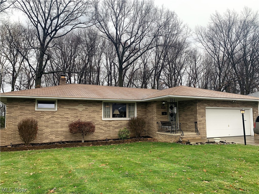 Fantastic value in this brick ranch in one of Seven Hills most sought after neighborhoods.  This home features a covered front entry with nice size foyer open to large living room and adjoining dining room.  Eat-in kitchen with newer ceramic tile floor and appliances (2014).  Spacious bonus family room with parquet floor and fireplace with adjoining screen 2 season sunroom.  Hardwood flooring on most of the first floor including under the carpeting.  Three bedrooms all with hardwood flooring and full bath complete the first floor.  Extra finished living space in the lower level with tons of storage.  Updated HVAC, windows, glass block windows and much more.  Wooded back yard and two car attached garage.  Showings begin Friday, December 18!  Welcome Home!