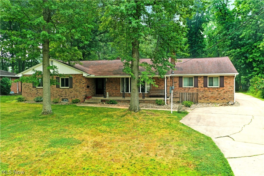 This sprawling, brick, ranch home in Canfield sits on 2.45 acres. Uniquely it's own, the property offers the convenience of neighborhood living in an outstand school district with the luxury of your own private sanctuary. You will be delighted by the spacious rooms, hardwood floors, vaulted ceilings and newly carpeted bedrooms. Both the kitchen and living room have their own fireplaces with stunning wooden mantels. The finished basement is a blank slate that the new owner can make their own. This type of home is not one that comes along everyday, don't wait, schedule your private showing now!