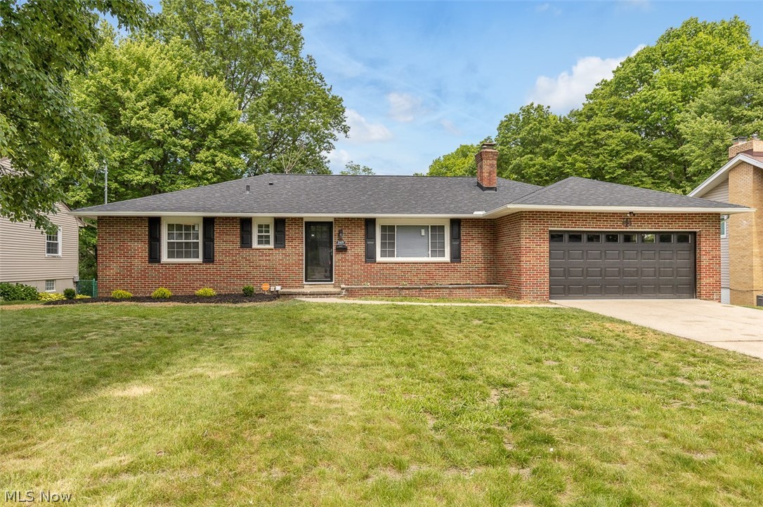 Welcome home to this beautifully renovated 4-bed, 3-bath brick residence in the heart of Sand Run Metro Park offering the perfect blend of character, and modern updates. From the moment you walk in, you'll appreciate the solid construction, and extensive improvements that make this home truly move-in ready. Step inside to find luxury vinyl flooring flowing throughout the home and a wood-burning fireplace greeting you at the entry. The fireplace will give you a new appreciation for Ohio winters. The open-concept kitchen and den create the perfect space, featuring quartz countertops, stainless steel appliances, and a layout designed for both everyday living and entertaining. Ceiling fans in every bedroom also add comfort and functionality. The primary suite serves as a luxurious retreat, highlighted by a stunning  en-suite bath featuring porcelain tile, a spacious walk-in shower with a custom niche, marble-topped vanity, LED mirror to highlight all of your natural beauty and angles, and a window that fills the space with beautiful natural light. Barn door accents add both character and privacy. Downstairs, the expansive finished basement delivers exceptional additional living space. Enjoy a custom media wall with open shelving and LED lighting, a wet bar perfect for entertaining, a 4th bedroom, 3rd bath, laundry, and abundant storage, including built-in utility cabinetry. Double access doors lead directly from the basement to the backyard patio area, creating seamless indoor-outdoor living. Outdoor spaces are equally impressive, featuring a raised back deck overlooking the patio—ideal for relaxing, entertaining, or enjoying the outdoors. For added peace of mind, every major component has been updated, including the hvac, hot water tank, electrical, plumbing, roof, windows, gutters, and doors. With its spacious layout, extensive renovations, and thoughtful design elements throughout, this home offers the perfect combination of comfort, style, and functionality.