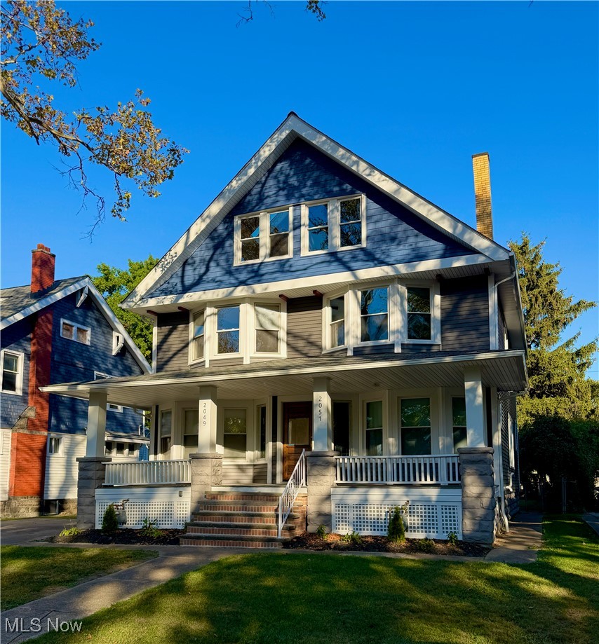 2049–2051 West Blvd., Cleveland, OH 44102 - Beautifully updated West Boulevard side-by-side two family home perfect for owner-occupant on one side and cover expenses by rent on the other! Each unit features modern updates while maintaining classic Cleveland charm. Kitchens have modern appliances, granite countertops, and  breakfast bars to dining rooms for an open-concept feel. Entire property has new paint, carpet, refinished hardwood floors, and fully updated bathrooms. The owner’s side offers 2 bedrooms, large walk-in tile shower, two sink vanity, and 2nd floor laundry room with utility sink and closet.  Tenant side has 3 bedrooms with rent estimated at $2,220/month.  Both units have beautifully finished 3rd floor lofts with exposed brick, wood beams, skylights, and separate heating and cooling units.  Basement for each provides ample storage with washer & dryer on tenant side. Updated heating & cooling systems (separately metered).  Owner’s side boasts tankless hot water tank for instant hot water. Fully updated electrical throughout. 2-car garage with additional driveway parking. 5 year old roof, high-end vinyl siding within the last year. Great curb appeal on a tree-lined street, just minutes from downtown, Edgewater Park, and Battery Park. Move-in ready!