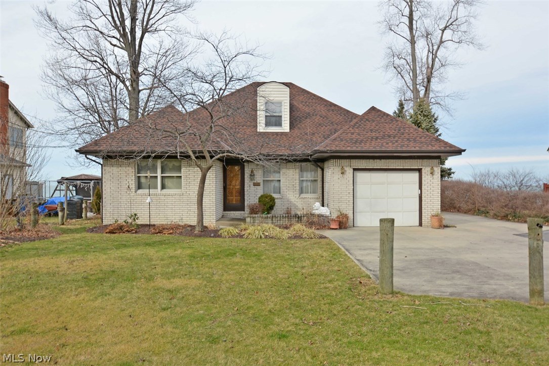 Direct lakefront paradise awaits you! Imagine beautiful sunsets with your friends and family. You've always wanted to live on the lake, here is your chance! This custom cape cod features a spacious, open floor plan with an abundance of windows overlooking Lake Erie. Two full size sliding glass doors on either end of the full brick fireplace open to to separate rear decks; each with stunning lake views. Huge gourmet kitchen has custom cabinetry, tons of cabinet and counter space, two full sinks and is open to the great room. Layout is perfect for parties and social gatherings! Home features first floor master bedroom with enormous walk in closet and large glamour bath. Two large bedrooms upstairs have great lake-views and share the second full bath. Upgrades include, new furnace in 2010, new roof in 2012 and new carpet in living room in 2012. This home has direct lake access! Stair case to the west end of the property takes you down to the cement capped break wall at the waters edge! Pe