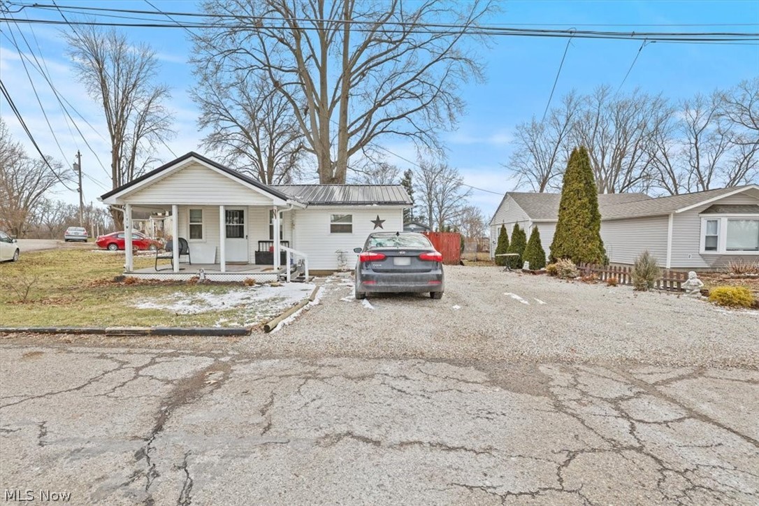 Welcome to this adorable cottage in Hebron, Ohio! Situated on a convenient corner lot, this charming home offers comfort, character and peace of mind with numerous updates throughout. Relax on the covered front porch before stepping inside to the living room with a dedicated dining area. The home features a full kitchen, full bath with new shower and plumbing as well as two comfortable bedrooms. The second bedroom does have the furnace installed. Step outside to enjoy the back patio surrounded by beautiful perennials, plus an invisible fence to keep your furry friends safe and secure. Major improvements since 2019 include: roof, gutters, bedroom ceiling, furnace, electric panel, windows, attic insulation, walk-in shower with updated shower plumbing, sump pump and vapor barrier in the crawl space (see attached documents for full details). Located close to I-70 and I - 79 for an easy commute. Property is located in a flood zone; seller reports no history of flooding since she has purchased. Don't miss this sweet gem, all that's left to do is move in and enjoy!