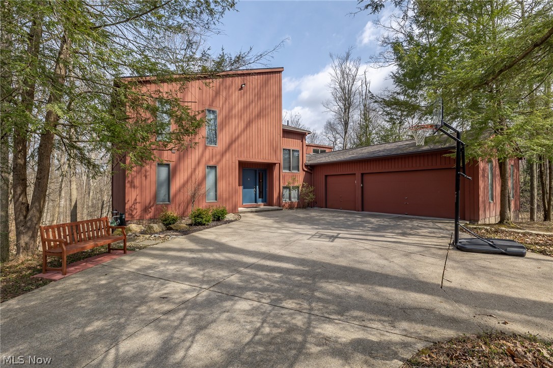 Welcome Home to this well kept contemporary colonial in The Reserve of Medina, an exceptional 4-bedroom home on a picturesque lot backing to a beautiful, wooded ravine. Just minutes away from Historic Medina Square and I-71/271. Offering privacy, and stunning views from the cozy sunroom and wrap around deck. The primary suite offers two walk-in closets & a spacious ensuite bath with double vanities. Do all your entertaining in the large eat in kitchen and fformal dining room.  The large walkout lower level includes the 4th bedroom, full bath, recreation room, storage space, and plenty of space for entertaining. Major updates, HVAC, Roof, Front Door, Garage Doors, Dishwasher, Refrigerator, and landscaping. You don't want to miss this one!