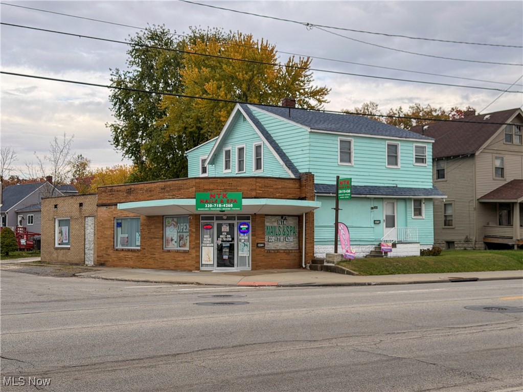 OPPORTUNITY AWAITS!  Just minutes from the Eastwood Mall, a few blocks east of Central Parkway. If you're looking for an amazing business opportunity, a chance to run and grow your own business, AND a new home, you need to come check out this Warren business with a 4 bedroom completely updated home attached.  Live in the house and run your business or rent out the house. Fully operational nail salon with 10 nail stations, 8 pedicure chairs, 1 waxing/facial room, 2 spot drying station, client restroom, employee restroom, laundry room with storage and new hot water tank.  The electrical box for the business has also all been updated.   All furnishings and inventory are included in the sale. (Over $150,000 worth of equipment and supplies)   The beautifully remodeled home has 4 bedrooms, a possible full kitchen on the 2nd floor as well.  (Home was previously a duplex) Kitchen, livingroom, dining room, entry way with closet and 1 full bath on the first floor.  You'll find 2 more full baths and 4 bedrooms upstairs. This whole building has been completely updated inside with new flooring, new paint, elegant updated lighting, modern LED lighted mirrors in all bathrooms,  hi-end kitchen appliances.  There is a 10x 12 shed out back for all your storage and a brand new 6 x 20 entertainment deck as well.  Both units have new central A/C units, the roof is 3 years old, all new vinyl windows.  There is a home warranty being offered on the house for a worry free purchase. The nail salon and home are connected through the basement.  There are security cameras on the property.